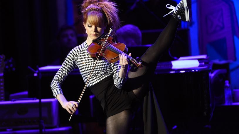 Violinist Lindsey Stirling will perform Aug. 19 at The Rose Music Center at The Heights. (Photo by Chris Pizzello/Invision/AP)