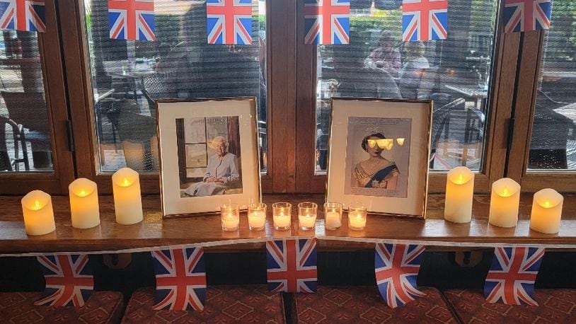 The Pub at The Greene in Beavercreek added a space for patrons to pay their respects to Queen Elizabeth II during the 10 days of mourning. CONTRIBUTED