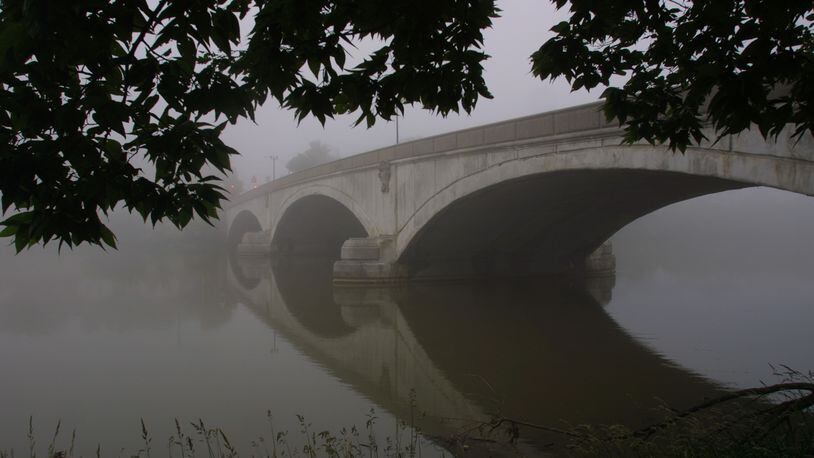 Wednesday morning fog shrouds the Helena Street bridge over the Great Miami River.