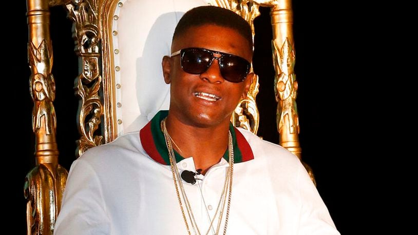 In this March 10, 2014, file photo, rapper Boosie appears at a news conference in New Orleans. Boosie faces charges of having a weapon and drugs after he was pulled over Monday, April 8, 2019, on a street south of Atlanta. He was was jailed on charges of having a gun during a crime; drug possession and a failing to maintain his lane.