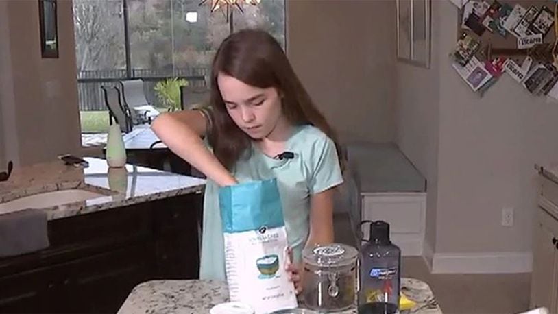 Jameson Shaw, 13, makes cookies during an interview with WJAX-TV in December 2019.