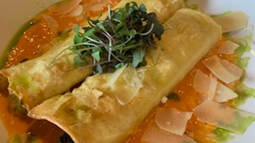 Watermark's house manicotti is filled with summer vegetable ratatouille (zucchini, squash, caramelized onion), ricotta and parmesan, topped with a smoky red
pepper cream sauce. CONTRIBUTED