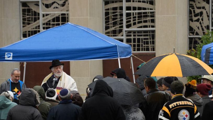 Worshippers listen to Rabbi Chuck Diamond, former Rabbi of the Tree of Life Congregation, as he conducts a Shabbat prayer vigil Saturday morning in the in front of the Tree of Life Synagogue on November 3, 2018 in Pittsburgh, Pennsylvania. Synagogues around Pittsburgh are opening their doors to members of the Tree Of Life congregation that was the target of a mass shooting that left 11 of its members dead on October 27.