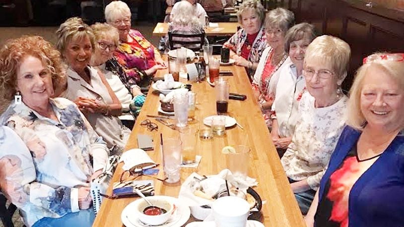 Ruth Addison (from left), Penny Lange, Carol Gainey, Janice Studebaker, Judy Halsall, Faye Fetters, Gretchen Locke, Patti Anderson and Kip Gibson enjoy dinner recently. CONTRIBUTED