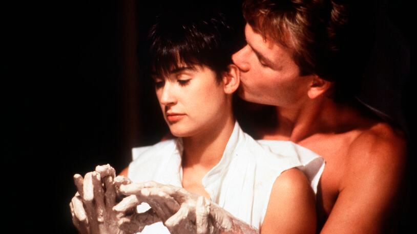 Demi Moore, left, and Patrick Swayze shared a memorable passionate kiss in the 1990 film "Ghost" (AP Photo/Paramount Pictures, file)