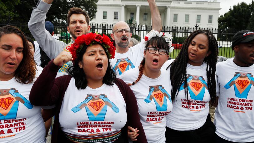 Wendolynn Perez, 23, second from left, a DACA recipient who is now a permanent resident and is originally from Peru, chants with other supporters of immigration reform, Tuesday, Aug. 15, 2017, at the White House in Washington. The protesters want to preserve the Obama administration program known as Deferred Action for Childhood Arrivals, or DACA. The Trump administration has said it still has not decided the program's fate.(AP Photo/Jacquelyn Martin)