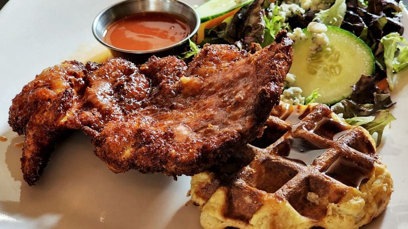 Taste of Belgium has opened at Liberty Center in Liberty Township. This is their chicken and waffle served with maple syrup and hot sauce. NICK GRAHAM/STAFF