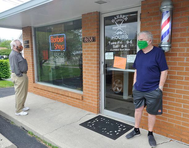 PHOTOS: Restaurants, salons reopen after coronavirus shutdowns