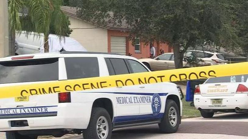 Orange county investigators respond to a report of the discovery of a woman's body  in a home in the Pine Hills neighborhood.