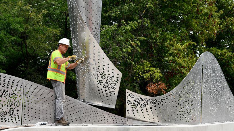  “Foliage,” a new Kettering public artwork, has been installed on the Ridgeway Road bridge. The stainless steel sculpture designed by Cliff Garten Studio in Venice, CA, mimics the landscape found within Hills & Dales MetroPark and Kettering. SHAYNA MCCONVILLE / CITY OF KETTERING
