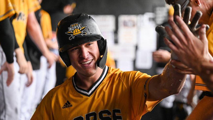 The golden smile of Northern Kentucky’s Colton Kucera that was preserved – “miraculously” said Colton’s mom, Staci – by local dentist Dr. Greg Notestine after Kucera was hit by a pitch in a game against Wright State at Nischwitz Stadium in early May. The 95 mph pitch knocked one front tooth out and into the dirt, knocked another into the back of Colton’s mouth, loosened other teeth, put a gaping hole through his lip and left him with a concussion (his third in three years) and bleeding profusely. CONTRIBUTED