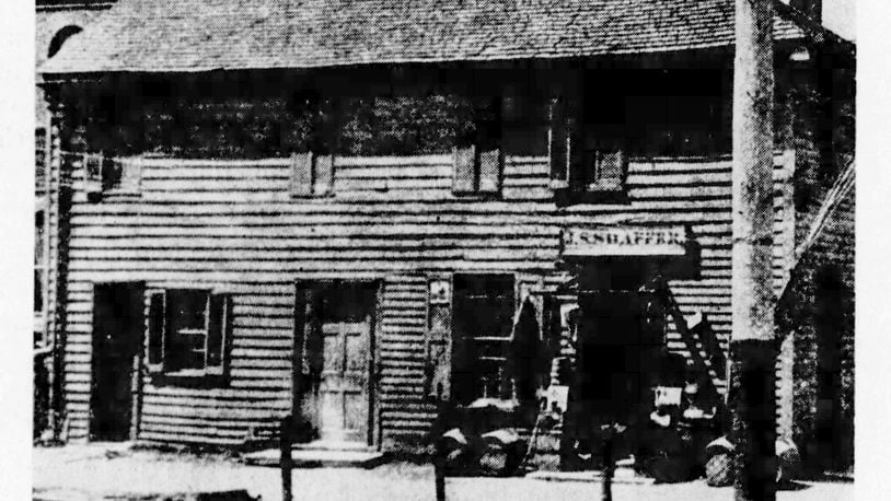 Historic Newcom Tavern, built in 1796, had its logs covered in this 1894 photograph.