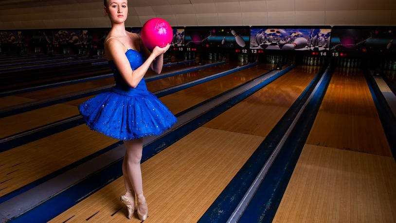 Clare Sherman, 15, with Miami Valley Ballet Theatre, poses for a photo at Pohlman Lanes and Family Entertainment Complex on Pyramid Hill Blvd. in Hamilton.  Hamilton’s very own Miami Valley Ballet Theatre dancers are trading out their ballet slippers for bowling shoes, for a very special performance at Pohlman Lanes. Their brand new show is a Fab Four inspired production featuring the music of the Beatles that features an exciting mix of contemporary and modern dance. The Ballet, Beatles and Bowling show is part of Fitton Center's "Outside The Box" series showcasing live arts at around Hamilton. The performance is Sunday, April 11 from 3-5 p.m. NICK GRAHAM / STAFF 