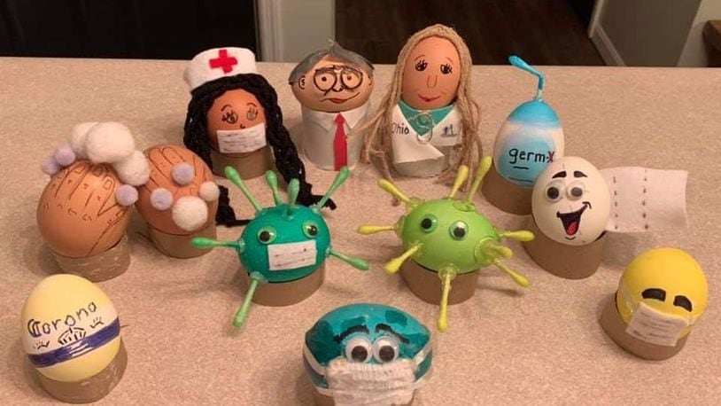 Gov. Mike DeWine and Ohio Health Director Dr. Amy Acton are the centerpiece of an Easter-egg creation by Stacy Sandlin and her daughter Addison, 15. They depicted (from left, along the outer circle) a Corona beer logo because some have mistakenly believed the brew was related to the virus; a pair of hands covered with suds as they wash themselves; a nurse; DeWine; Acton; a hand sanitizer; smiling roll of toilet paper; an emoji with a face mask; and inside, two coronavirus germs; plus our planet wearing a face mask. PROVIDED