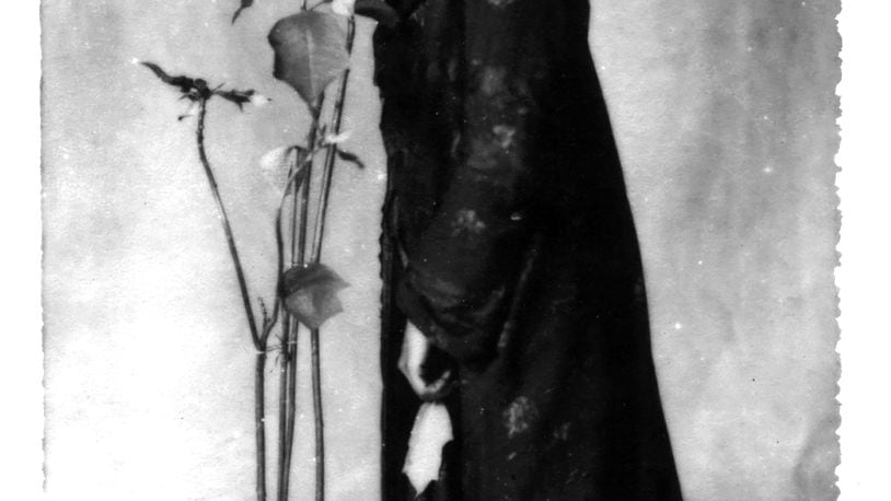 "The Poinsettia Girl," is Reece's self-portrait taken in 1907. PHOTO COURTESY OF THE DAYTON ART INSTITUTE