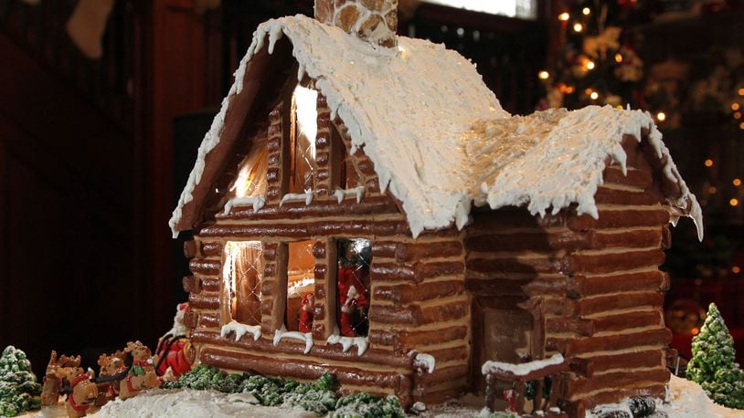 Donna Brinson-Alexander of Brookville is the professional division winner of the 2013 Gingerbread Home for the Holidays contest. She created her home to look like a log cabin. LISA POWELL / STAFF