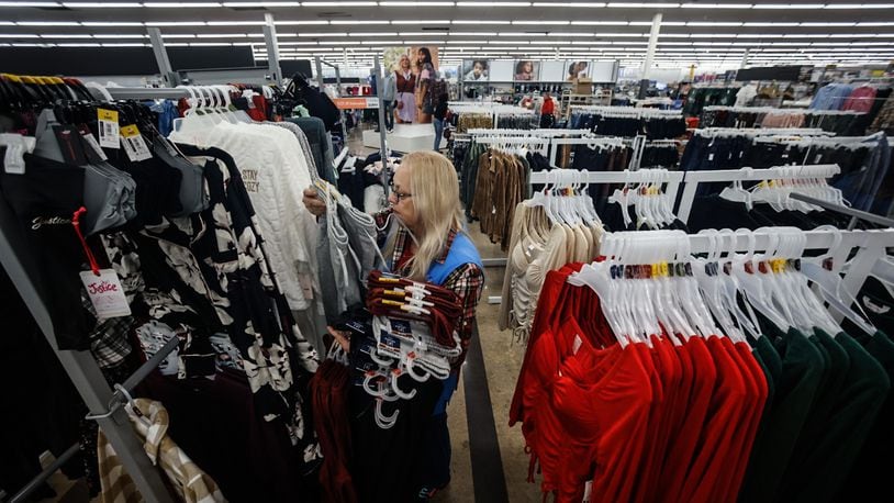 Angie Furlong restocks clothing at the Beavercreek Walmart Monday November 14, 2022. The Beavercreek Walmart is upgrading their store making it easier to find what customers are looking for. JIM NOELKER/STAFF
