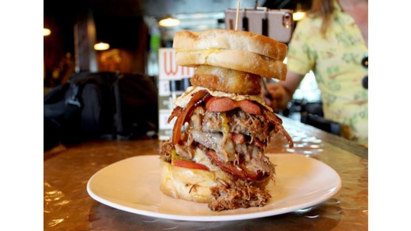 Can you handle the Wandering Griffin's 'monster burger'? This double-dare of a sandwich involves a heap of meat, cheese and more meat and cheese between two grilled cheese sandwiches. PHOTO / Amelia Robinson