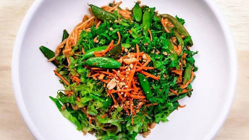 Spicy peanut ginger noodles with sauteed carrots and sugar snap peas in white wine, by Chef Da'Ves Malone of Sprouting Dreams LLC. SPROUTING DREAMS PHOTO