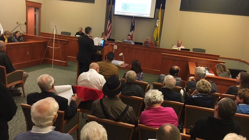 A proposal to build 88 homes on nearly 32 south of the Dayton Mall drew more than 70 people - many who question the plan - a Miami Twp. Zoning Commission meeting in March. NICK BLIZZARD/STAFF