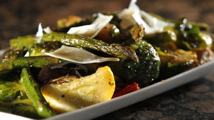 The Amber Rose Restaurant and Catering is a Dayton institution specializing in homemade Eastern European cuisine. On the menu is a plate of fresh season vegatables, a mix of asparagus, brussel sprouts, squash, zuchini, egglplant and peppers. LISA POWELL / STAFF