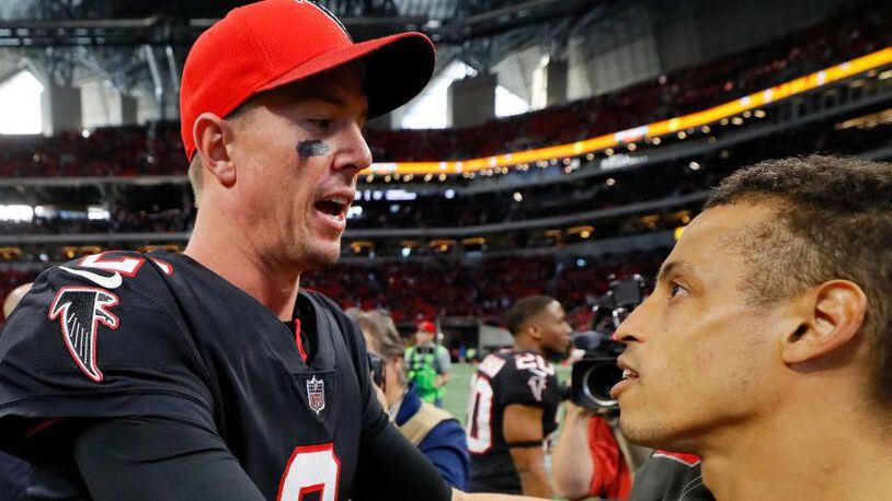 Matt Ryan #2 of the Atlanta Falcons talks to Brent Grimes #24 of the Tampa Bay Buccaneers after the game at Mercedes-Benz Stadium on November 26, 2017 in Atlanta, Georgia. (Photo by Kevin C.  Cox/Getty Images)