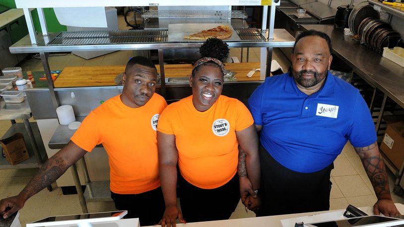 Story's Pizza & Smoothies is a family owned business located at 2741 West Alex Bell Road in Moraine. The Smith family from left, Cory, Ona, and their father, Steve, enjoy running the business. MARSHALL GORBY\STAFF