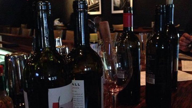 Wines at the bar of Coco’s Bistro in Dayton, which will be one of two destinations of Buckeye Road Trips’ new “Uncorked Monday” wine tour. Photo from Coco’s Bistro Facebook page.