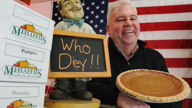 Brian Phillips, owner of Mehaffie Pies, displays the Joe Burrow 9" pumpkin pie. The business is offering, Who Dey! Super Bowl Party Packs. MARSHALL GORBY\STAFF