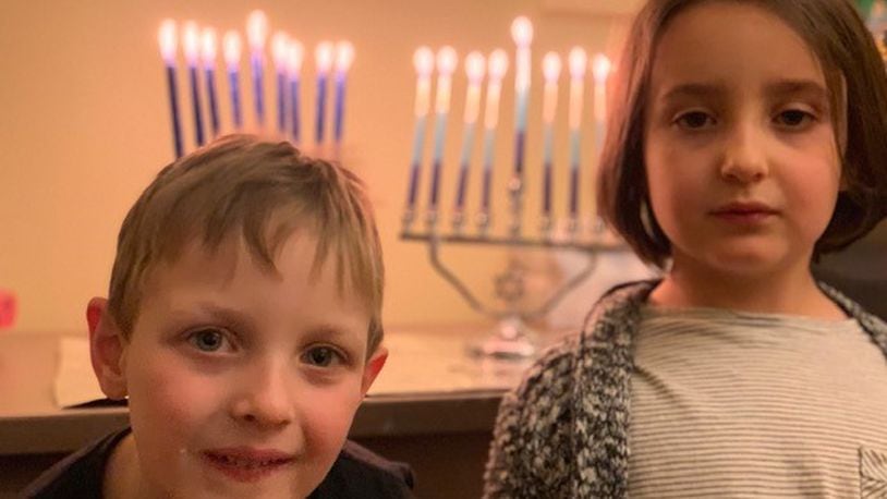 Twins Jonah and Lana will be celebrating Hanukkah on a much smaller scale than usual this year with their parents, Masha Kisel and Sam Dorf. CONTRIBUTED