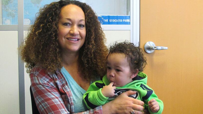 In this March 20, 2017 photo, Rachel Dolezal poses for a photo with her son, Langston in the bureau of the Associated Press in Spokane, Wash. (AP Photo/Nicholas K. Geranios)