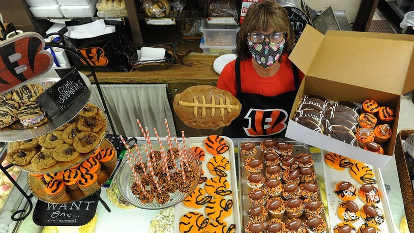 Theresa Hammons the owner of Ashley's Pastry Shop located at 21 Park Ave. displays all the Bengal treats they have for sale. Football bread, cupcakes, cookies and cake pops.  MARSHALL GORBY\STAFF