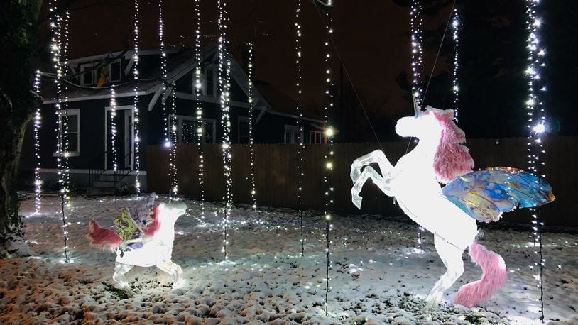 The Crofts’ holiday light display features 5 unicorns and around 4,000 lights hanging from the trees and covering the ground. CONTRIBUTED