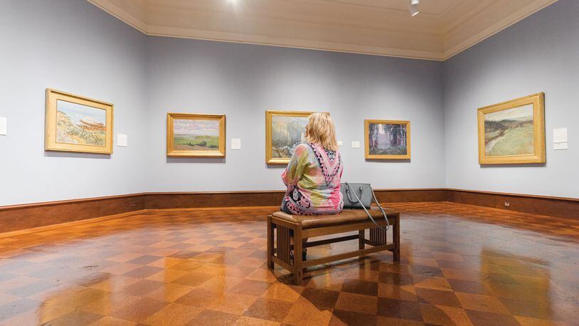 A guest ponders the artwork within the Dayton Art Institute. CONTRIBUTED