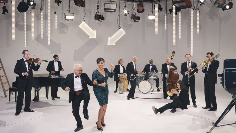 Pink Martini, led by pianist and founder Thomas Lauderdale (third from left), performs at the Schuster Center in Dayton on Friday, March 3. CONTRIBUTED