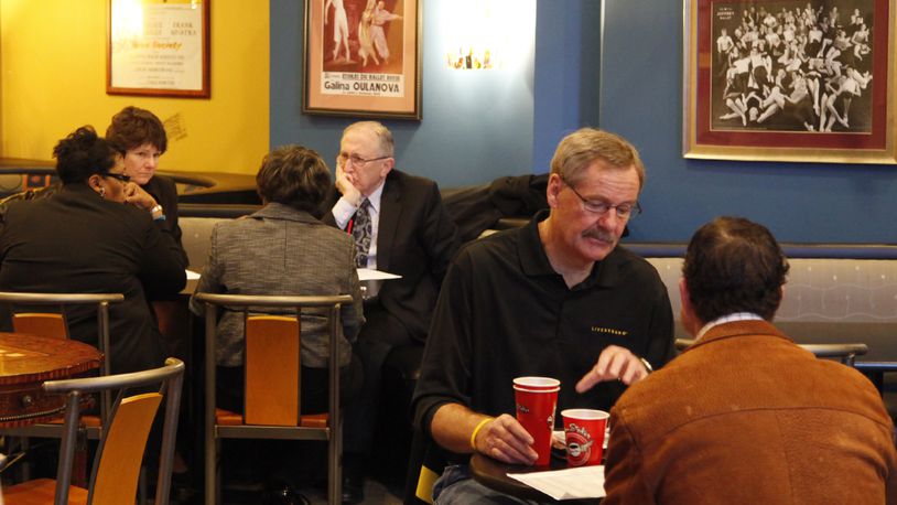 2012 Archived PHOTO: Patrons of the Boston Stoker downtown Dayton discuss business over morning coffee. -- Staff Photo by Ty Greenlees