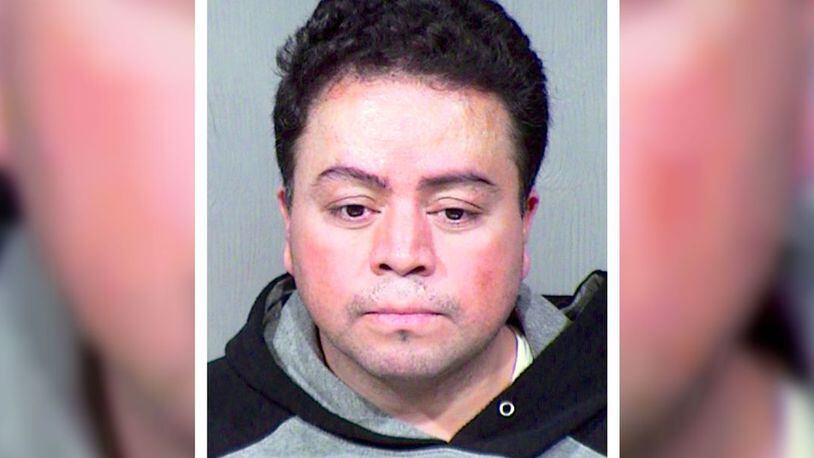 Adan Perez Huerta, 37, of Mesa, Ariz., was arrested in Toronto and extradited Thursday, Jan. 30, 2020, back to Maricopa County, where he was booked into the jail in connection with a negligent homicide conviction from March 2003. (Maricopa County Sheriff's Office via AP)