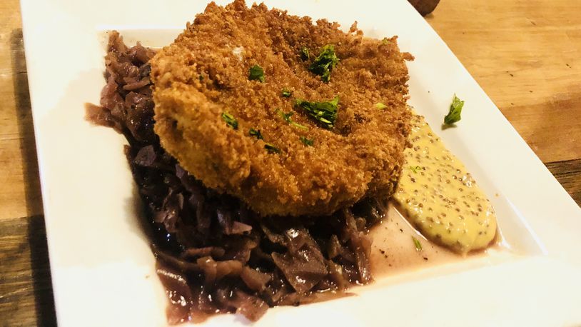 Schnitzel with braised red cabbage and whole grain mustard is on the daily German-style menu at Lock 27 Brewing Company for 'Loktoberfest' STAFF PHOTO