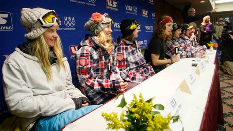 The new U.S. Olympic Snowboard Team from left; Hannah Teter, Gretchen Bleiler, Kelly Clark, Shaun White, Louie Vito, Scott Lago and coach Mike Jankowski take part in a news conference after they were announced at the U.S. Snowboarding Grand Prix finals, Saturday, Jan. 23, 2010, in Park City, Utah.