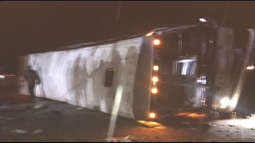 A bus carrying members of the University of Washington band overturned on an interstate highway Wednesday night.