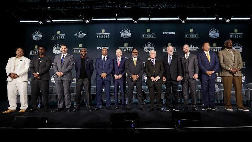 Hall of Fame Class of 2020, from left, Troy Polamalu, Edgerrin James, Steve Hutchinson, Isaac Bruce, Steve Atwater, Paul Tagliabue, Donnie Shell, Jimmie Johnson, Cliff Harris, Bill Cowher, Jimbo Covert, and Harold Carmichael pose at the NFL Honors football award show Saturday, Feb. 1, 2020, in Miami.