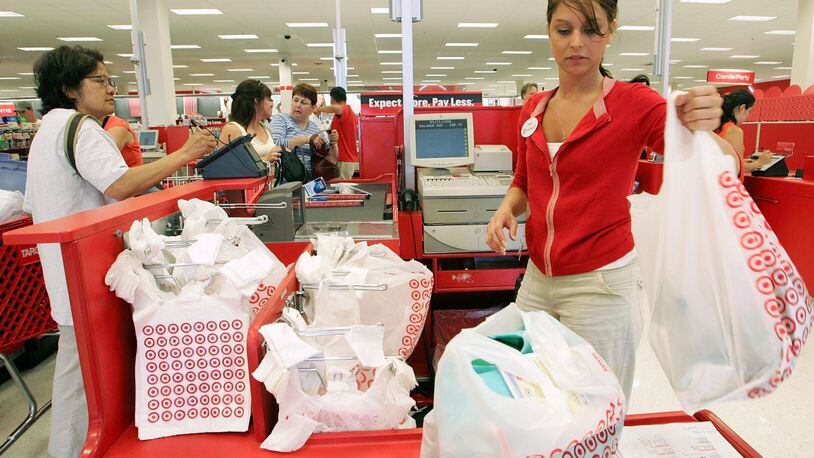 FILE PHOTO: A Target cashier rings up customers at a Target store.