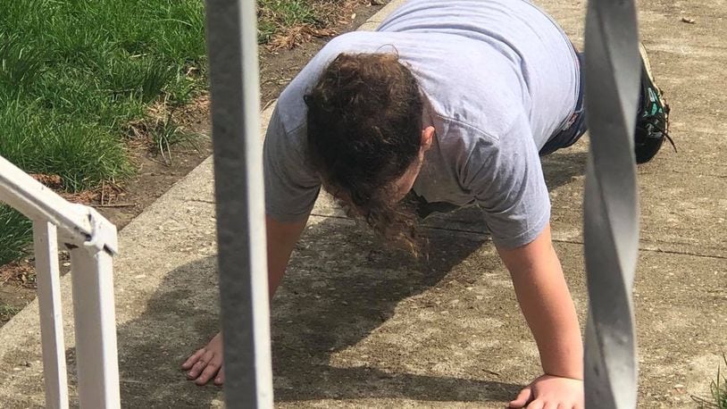 Cate Tankersley’s daughter got outside Friday to do some push-ups after softball practice has been cancelled because of coronavirus. CONTRIBUTED