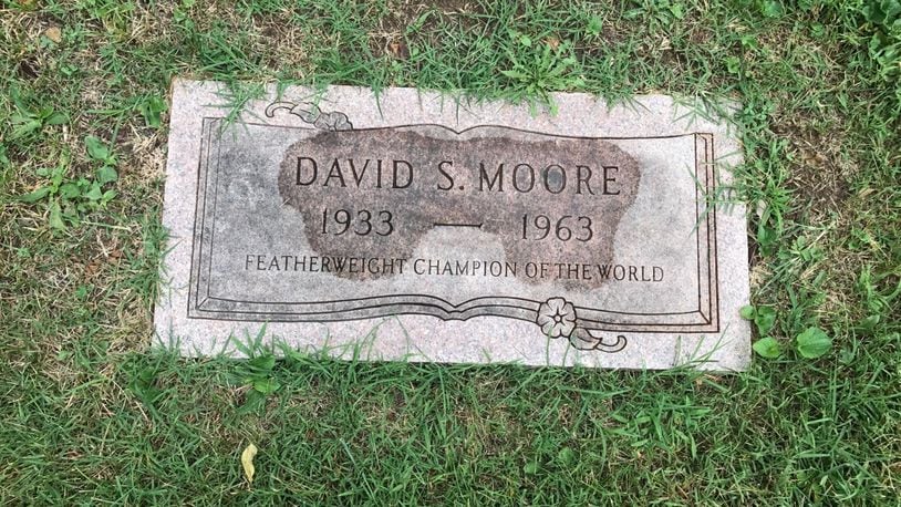 The gravestone of Davey Moore, the world featherweight champ from Springfield, who died from injuries sustained in his nationally televised world title fight with Ultiminio “Sugar” Ramos at Dodger Stadium in March of 1963. Over 10,000 people came to his funeral viewing in Los Angeles and another 10,000 passed his casket as he lay in rest in Springfield. Thousands followed his casket from the church to Ferncliff Cemetery for his burial. Tom Archdeacon/CONTRIBUTED