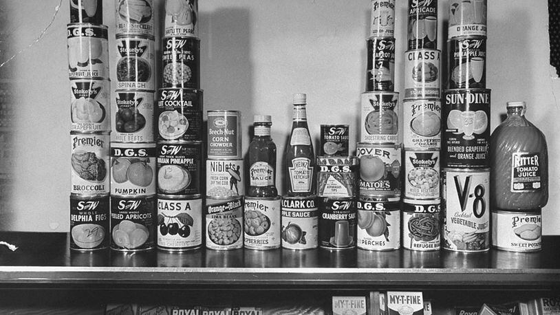 Canned goods sitting on shelf waiting to be purchased with ration stamps.  (Photo by Myron Davis/The LIFE Picture Collection/Getty Images)
