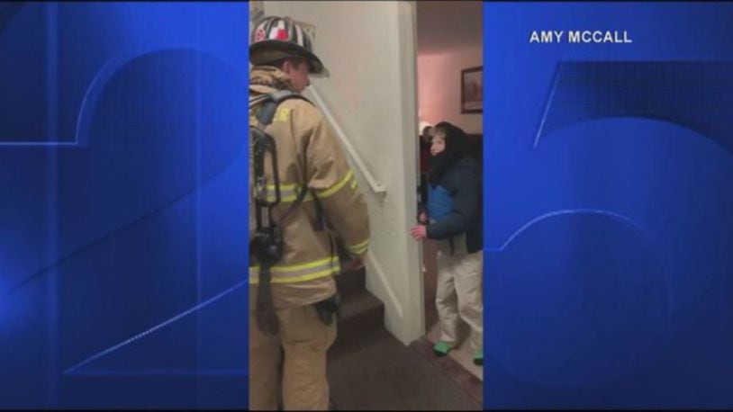 A firefighter used sign language to talk with a special needs boy. (Photo: Boston25News.com)