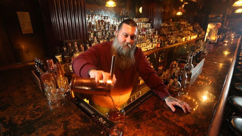 Joe Head co-owns the Century Bar in downtown Dayton with Diane Spitzig. LISA POWELL / STAFF
