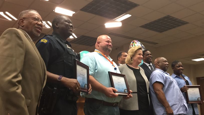Dayton employees were honored at a city commission meeting for their work and customer service. CORNELIUS FROLIK / STAFF