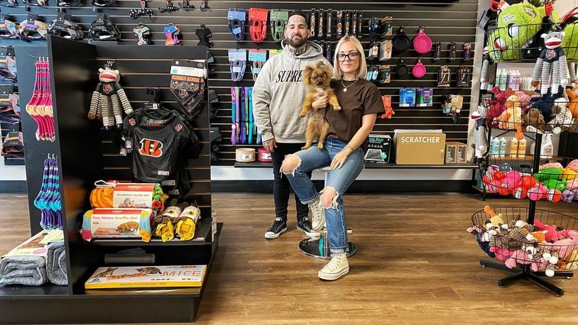 Norman’s Pet Supply Co is located at 225 N. Main Street in Dayton. Pictured are owners Donny Bussinger and Brittany Clausing with her dog, Norman. (CONTRIBUTED PHOTO).