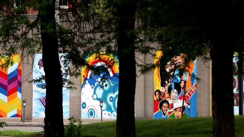 "Land of Funk," a 21-panel tribute to Dayton funk, has been painted along the Stone Street railroad wall. LISA POWELL / STAFF